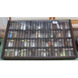 A glazed case containing a large quantity of chemicals in glass phials