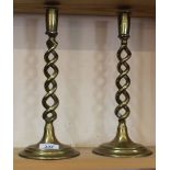 A pair of brass barley twist candlesticks