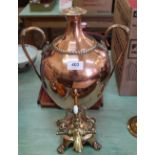 A 19th Century copper samovar of ovoid pedestal form with waisted lid, twin swan neck handles,