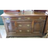 A large Edwardian oak five drawer,