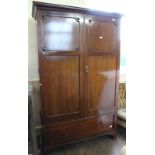 A 1920's mahogany double wardrobe with single drawer