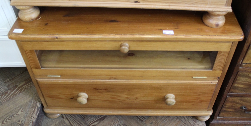 A pair of pine dining chairs and a pine TV stand