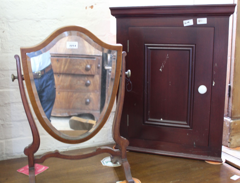 A Regency mahogany shield swing toilet mirror and a corner cupboard