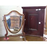 A Regency mahogany shield swing toilet mirror and a corner cupboard