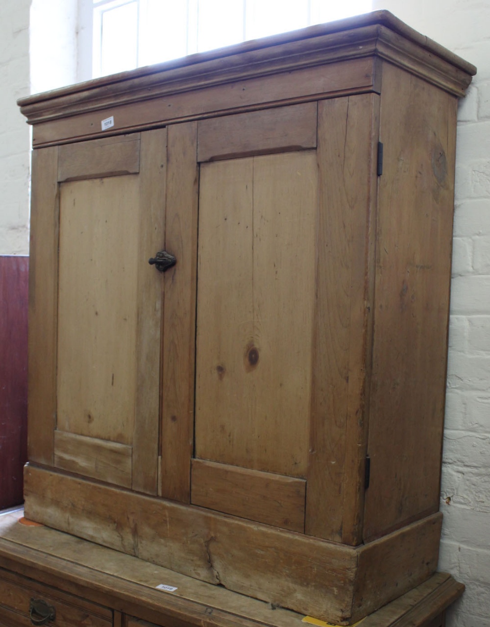 A mid Victorian two door cupboard