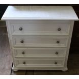 A modern white painted chest of four drawers