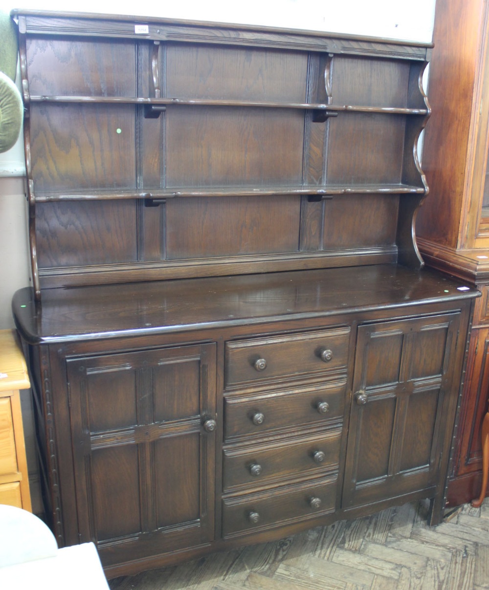 An Ercol style dark stained dresser