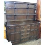 An Ercol style dark stained dresser