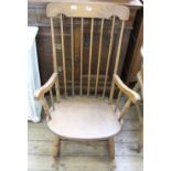 A 1920's beech Grandmother stick back rocking chair