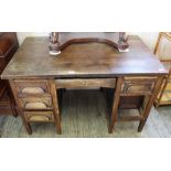 A 1920's oak seven drawer pedestal desk