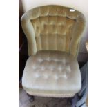 A 1930's velour button back and button seat chair