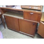 A vintage teak mini bar with two sliding door base