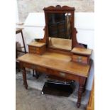 An Edwardian mahogany dressing table with four drawer upstand