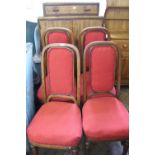 A set of bentwood and red velour upholstered dining chairs, bearing label Thonet,
