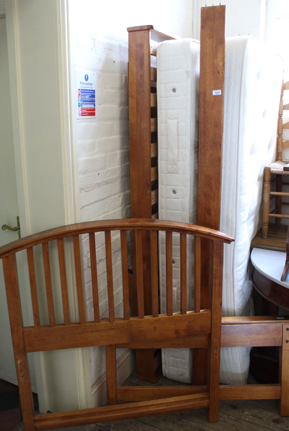 A modern oak bed that converts from two singles (one under the other) to a double (with mattresses)