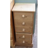 A narrow pine chest of five drawers