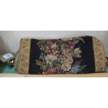 A floral tapestry scroll hanging