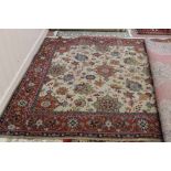 A machine made Persian pattern floral carpet,