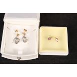 A pair of 9ct gold Welsh gold earrings plus a pair of 9ct gold earrings set with purple stones
