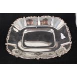 A large Egyptian silver dish with scroll border