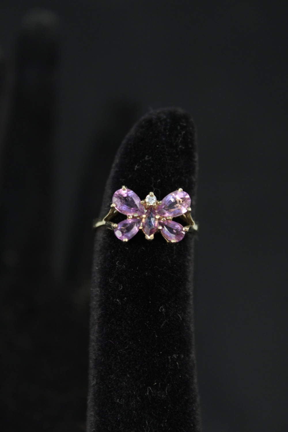 A 9ct gold ring set with amethyst and small diamond in butterfly form,