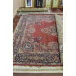 A machine made Persian pattern floral carpet,