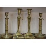 A pair of Adam style brass candlesticks with fluted and beaded decoration and detachable sconces,