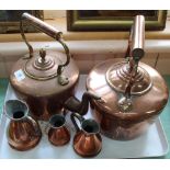 Two 19th Century circular seamed copper kettles plus a set of three small graduated copper measures