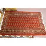 A Persian brown ground rug,