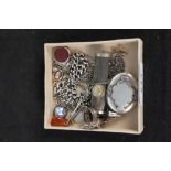 A collection of silver and white metal jewellery including locket, fob,