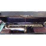 A cased silver plated Douchet Paris René Guenot saxophone