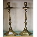 A pair of heavy late 19th Century hexagonal shaped brass candlesticks with drip trays,