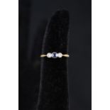 An 18ct platinum set sapphire and diamond ring,