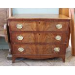 A Georgian mahogany chest of three long drawers on splayed feet with brass plate handles