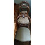 A pair of Victorian mahogany balloon back dining chairs and one other