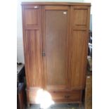 An Edwardian satinwood single wardrobe with single drawer below