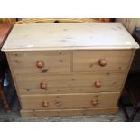 A pine chest of two short and two long drawers