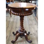 A 19th Century burr walnut and mahogany oval sewing box on turned column base