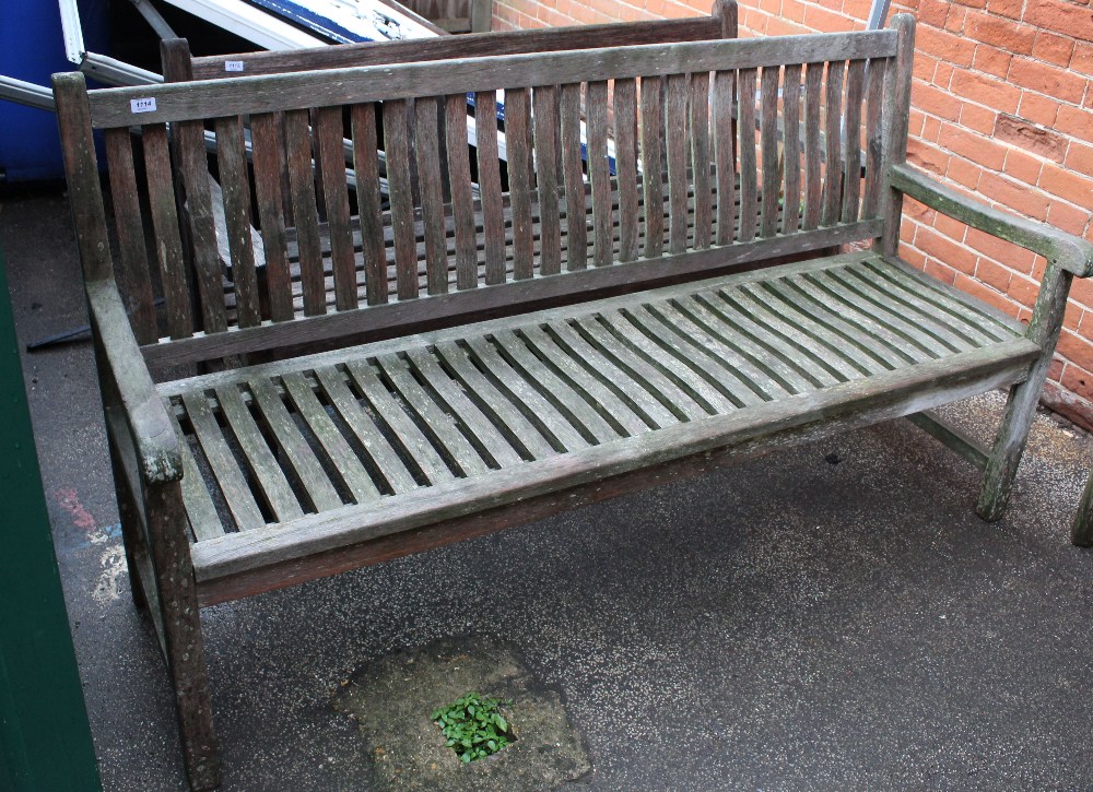 A large teak garden bench