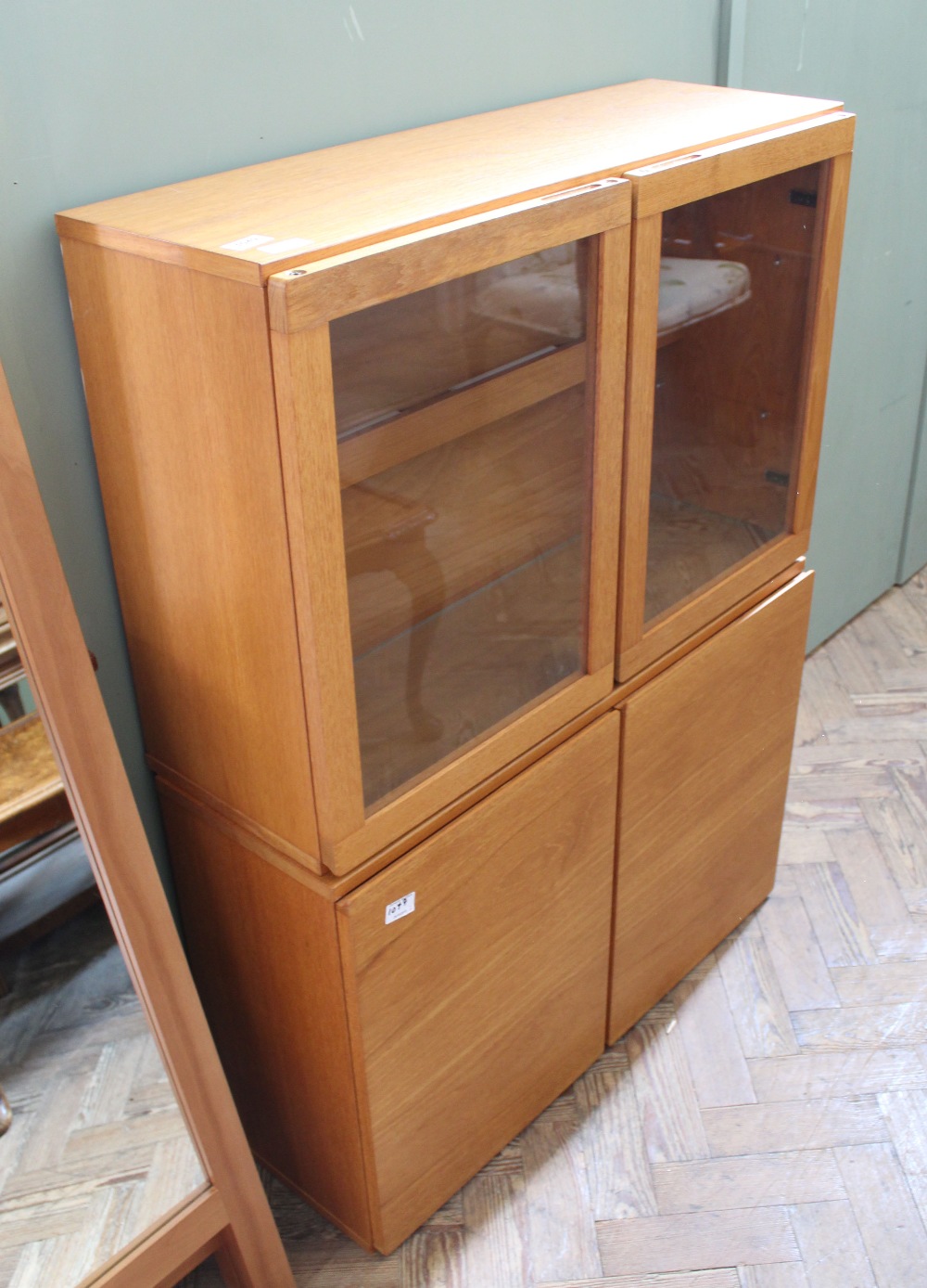 Two teak display cabinets