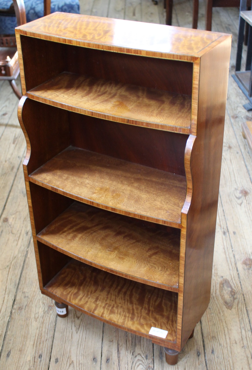 A bespoke miniature freestanding bookcase