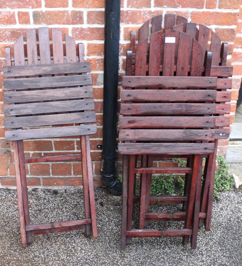 A set of four folding outdoor chairs