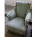 A 1950's pale green velvet upholstered armchair