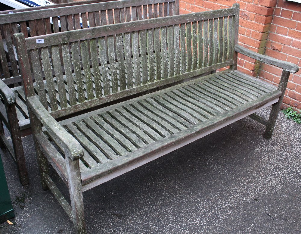 A large teak garden bench