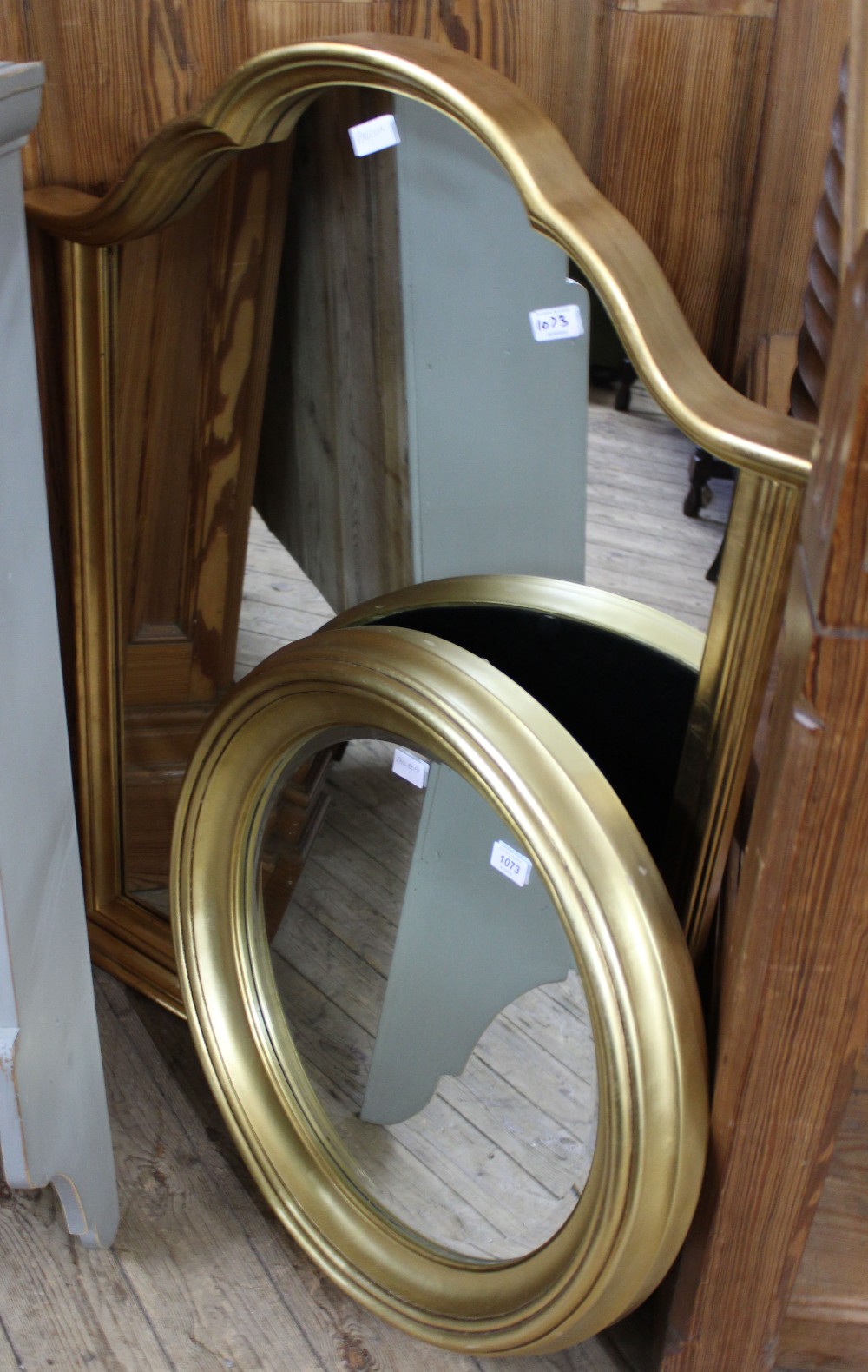 Two modern gilt mirrors one arched and the other circular