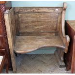 A 19th Century adapted church pew corner seat