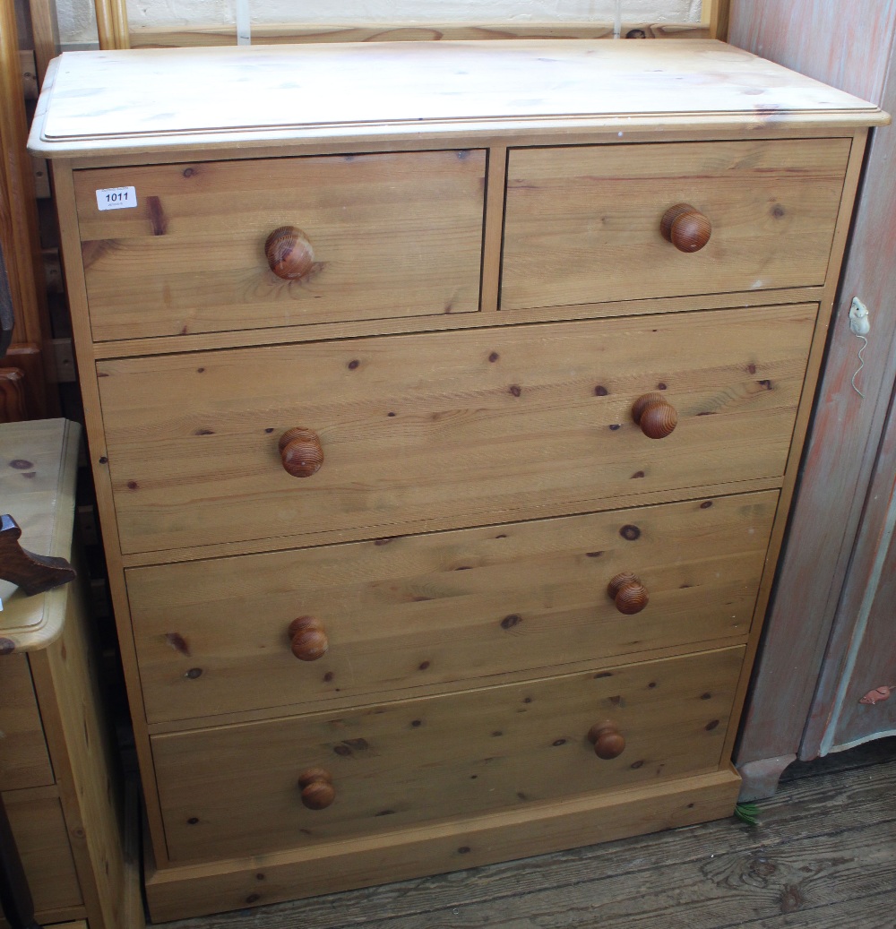 A pine chest of two short and three long drawers