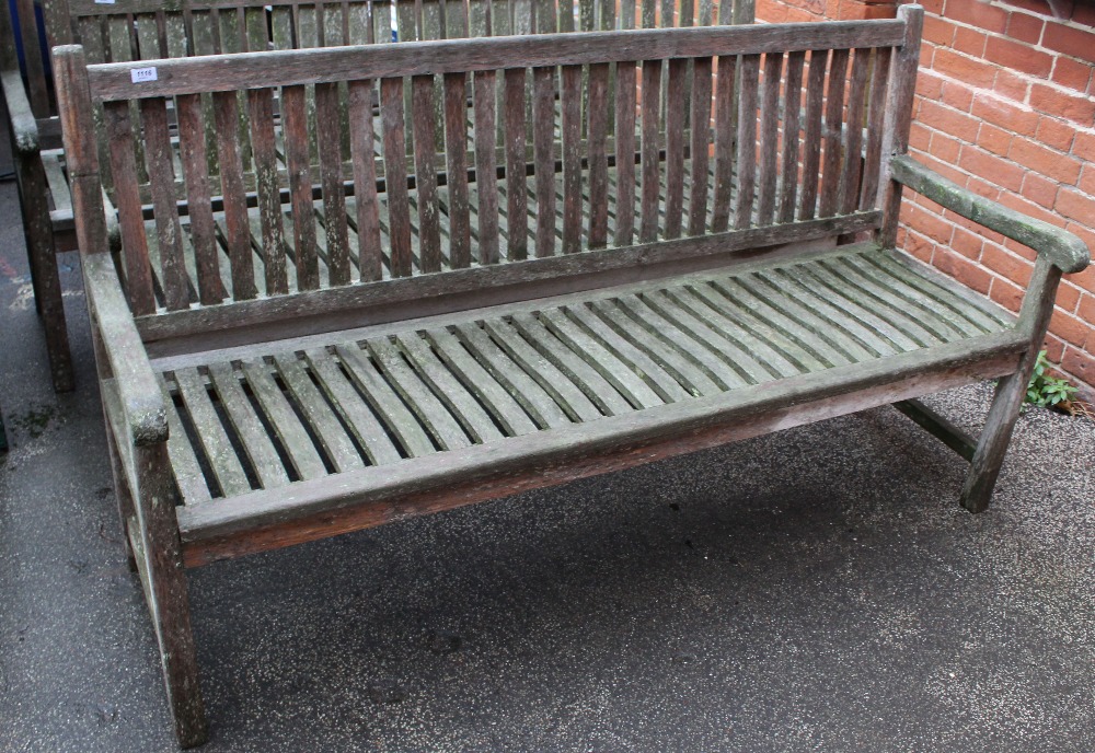 A large teak garden bench