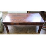 A mangowood and black metal bound two drawer coffee table