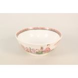 A Lowestoft bowl, enamels with Chinese lady and boy sat in a garden with fence and squirrel,